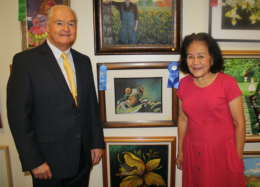 Freeholder John P. Curley congratulates Yachi Pan of Freehold for winning Best in Show in the nonprofessional category for her pastel entitled “Hopper” at the 2015 Monmouth County Senior Art Contest & Exhibition on August 19, 2015 at the County Library Headquarters in Manalapan, NJ.